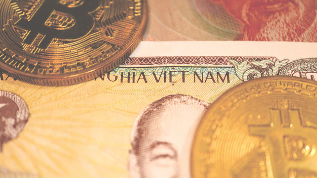 Close up the Vietnamese Dong Banknotes and Bitcoin