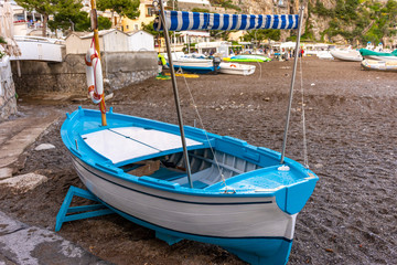 Fototapeta na wymiar Fishing boat aground on the beach