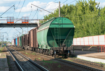 Fototapeta na wymiar train with tank cars on the railroad tracks in the sky