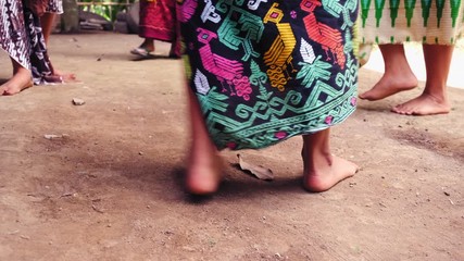 real time truck style floor level shot of Bali woman dancing in a circle