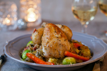 Whole roast poussin with brussel sprouts and carrots in cider gravy