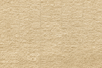 Fototapeta na wymiar Granite tiled wall background rough texture in natural light yellow cream color