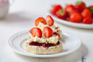 Scones with cream and strawberries