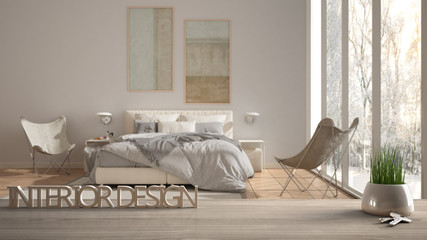 Wooden table, desk or shelf with potted grass plant, house keys and 3D letters making the words interior design, over blurred modern bedroom, project concept copy space background