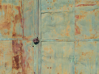 rusty lock hanging on old iron gate