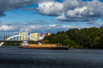 Fototapeta na wymiar Dry cargo ship on the Moscow Canal river in summer day.