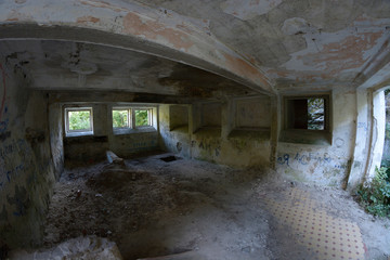 Empty hall of an abandoned  water power station in the forest. Buksky canyon, Ukraine