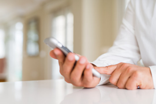 Close up of business man hands using smarpthone