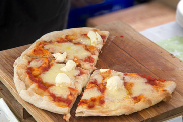 pizza on the wooden plate