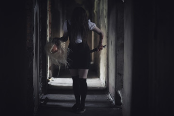 Fototapeta na wymiar Girl from horror movie with knife