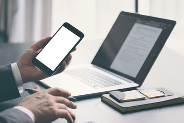 Close up of male hands with smartphone. Blank screen, Mock-up, copyspace ready for text or design