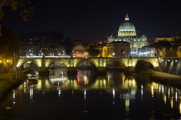 Fototapeta premium Night scene of Rome, Tevere river with basilica in background