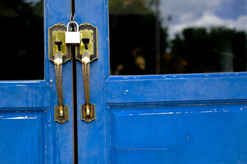 Lock the door. close the door. blue door is locked