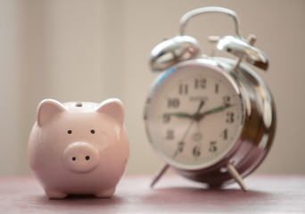 piggy bank and alarm clock
