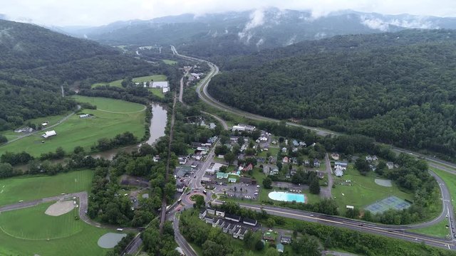 4K aerial establishing shot of the small American town of Waterbury, Vermont, in the Green Mountains, USA