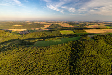 Aerial view at a landscape in Germany, Rhineland Palatinate near Bad Sobernheim with trees, meadow, farmland, forest, hills, mountains