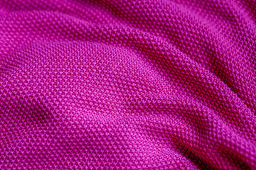 Fototapeta na wymiar Pink woolen fabric cloth background