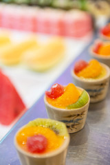 Fruit Cocktail Row on plate with blur background