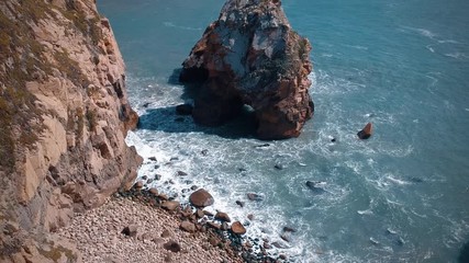 Aerial view from a rocky wild beach with amazing rocks. Atlantic coastine, Portugal. Drone view
