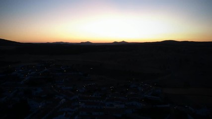 Aerial view from an amazing sunset in Alentejo, Portugal. With agricultural fields in background.