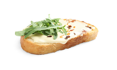 Slice of bread with spread and arugula on white background