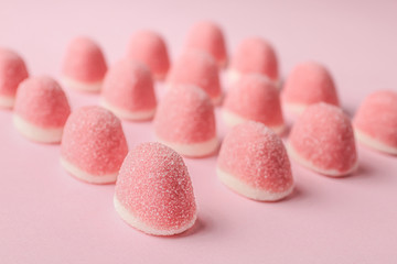 Obraz na płótnie Canvas Sweet bright jelly candies on pink background