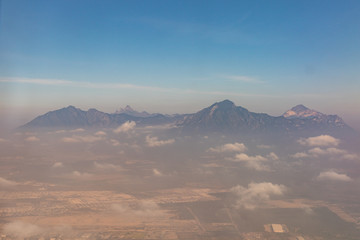 Fototapeta premium Mountains and vistas seen from the air from Mexico City to Monterrey.