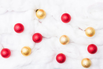 Christmas toys on a background of white snow made of cotton, for advertising, close up