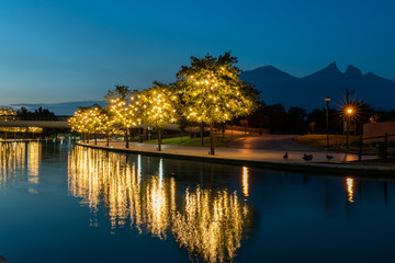 Fototapeta na wymiar MONTERREY, NUEVO LEON / MEXICO - July 11, 2019: Dawn in the middle of the river walk in Monterrey