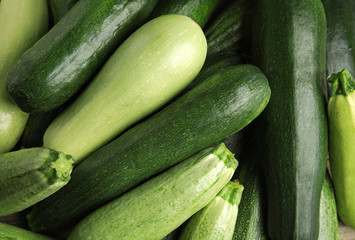 Top view of fresh ripe zucchini as background, closeup