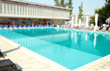 Obraz na płótnie Canvas Blurred view of clean swimming pool on sunny day