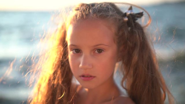 Child girl looking at camera with smile