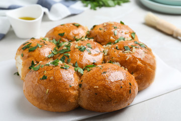 Traditional Ukrainian garlic bread (Pampushky) on table, closeup