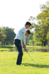 Naklejka na ściany i meble Trainer golf tutor practice for new golf player.