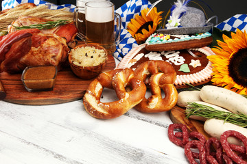 Traditional German cuisine, Schweinshaxe roasted ham hock. Beer, pretzels and various Bavarian specialties. Oktoberfest background