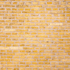 part of yellow or gold colored brick wall