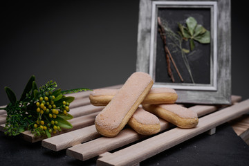 Ladyfinger biscuits for a Classic tiramisu dessert and a glass cup of coffee for dipping