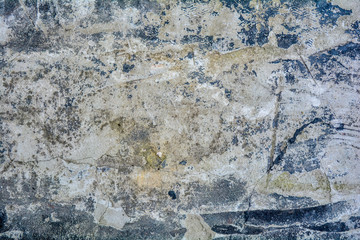 Texture of rough concrete or cement surface with stains of black paint and dirt