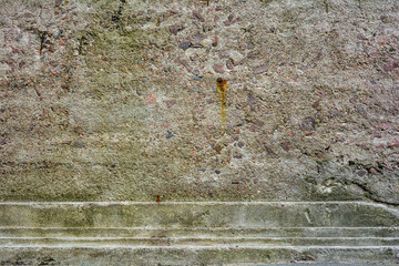 Old rough surface of cement, concrete wall with large sand, stones fractions