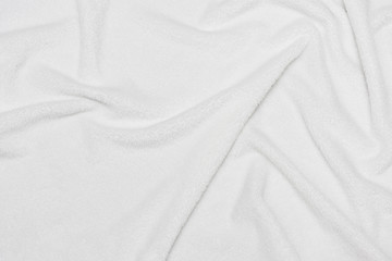 Fototapeta premium White crumpled blanket, texture, top view
