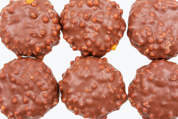 Six сookies with chocolate icing on white background, top view, isolated