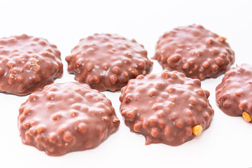 Six сookies with chocolate icing on white background, top view, isolated