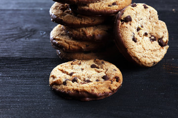 Chocolate cookies on wooden table. Chocolate chip cookies shot on table