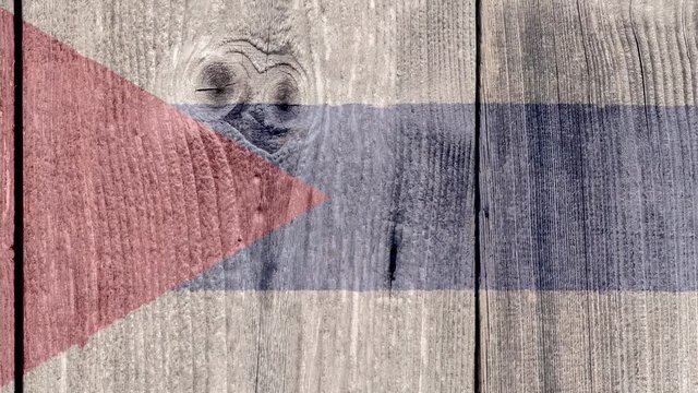 Cuba Politics News Concept: Cuban Flag Wooden Fence, Zoom Out