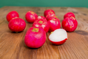 purple colorful radish on wooden board.