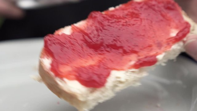 Lockdown: Removing Remaining Jam on the Knife by Spreading on the Bread - Smaland, Sweden
