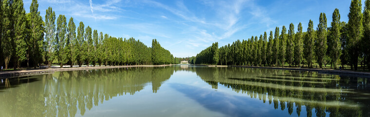 Fototapeta na wymiar Panoramic view of Grand canal in Parc de Sceaux in summer - Hauts-de-Seine, France.