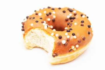 Brown donut with bright sprinkles, white background,