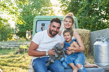 Family on farm.Harvesting Watermelons. Pickup with watermelons. Picnic on farm.Family day.Mother and father's day greeting card. Organic Farming, Food and Vegetable Production.Bio food. Garden produce