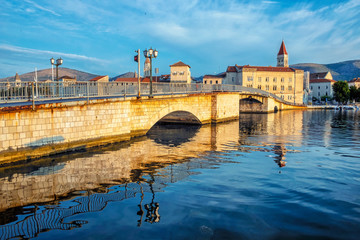 Bridge to Trogir is mirroring in sea, Croatia, sunrise time